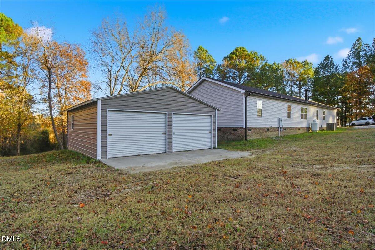 287 Moss Stock Farm Road Kittrell, NC 27544 - Photo 4 of 54 a house with a yard