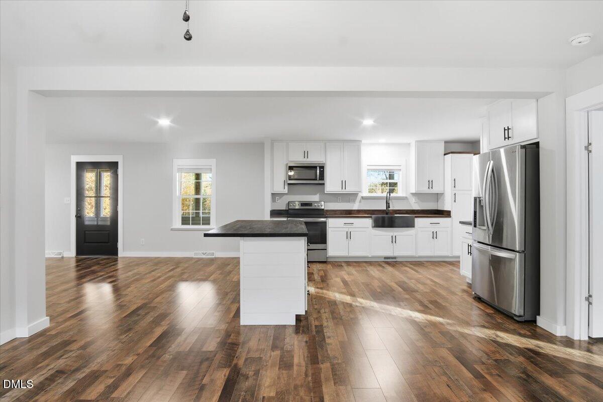 287 Moss Stock Farm Road Kittrell, NC 27544 - Photo 7 of 54 a kitchen with stainless steel appliances a refrigerator sink and microwave