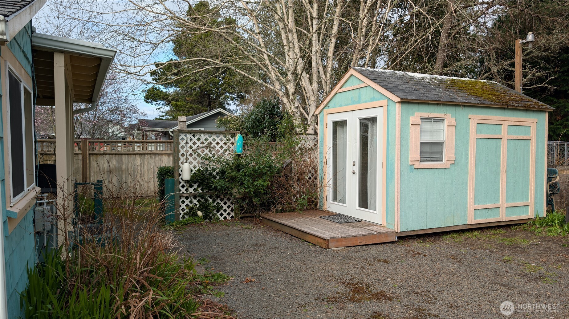 4106 Pacific Way Seaview, WA 98644 - Photo 16 of 21 a view of a house with a yard and plants
