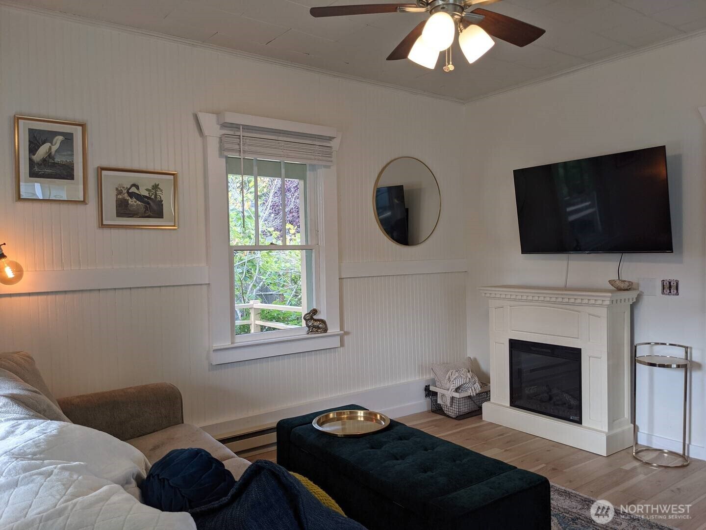 4106 Pacific Way Seaview, WA 98644 - Photo 9 of 21 a living room with furniture a fireplace and a flat screen tv