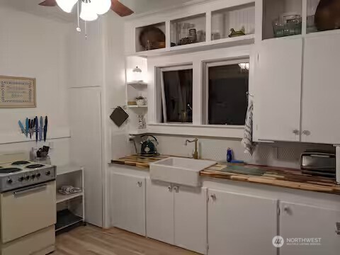4106 Pacific Way Seaview, WA 98644 - Photo 10 of 21 a kitchen with a sink stove and cabinets