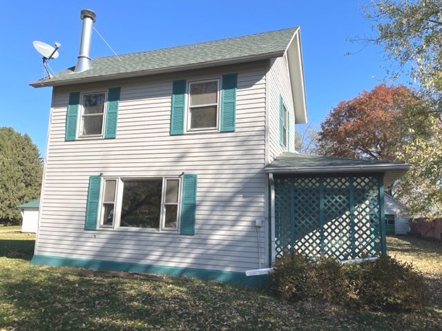 404 North Main Coleta, IL 61081 - Photo 1 of 32 a front view of a house with a yard