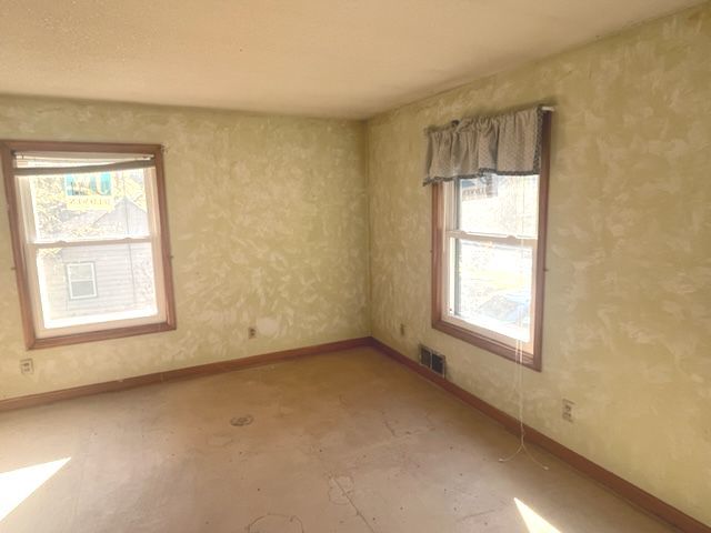 404 North Main Coleta, IL 61081 - Photo 15 of 32 an empty room with a window