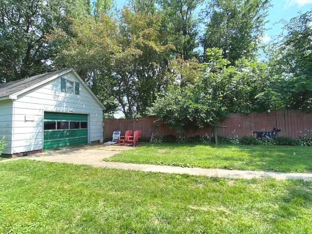 404 North Main Coleta, IL 61081 - Photo 17 of 32 a house view with a sitting space and garden