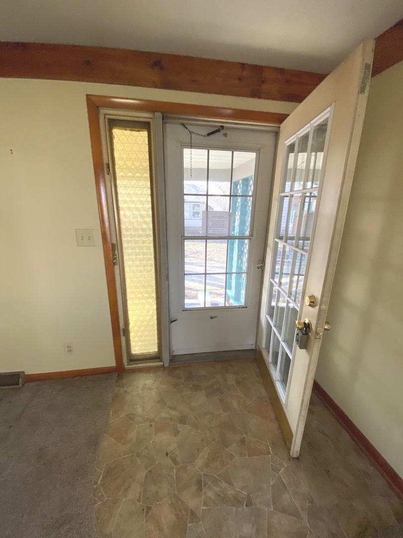 404 North Main Coleta, IL 61081 - Photo 4 of 32 a view of an empty room with a window