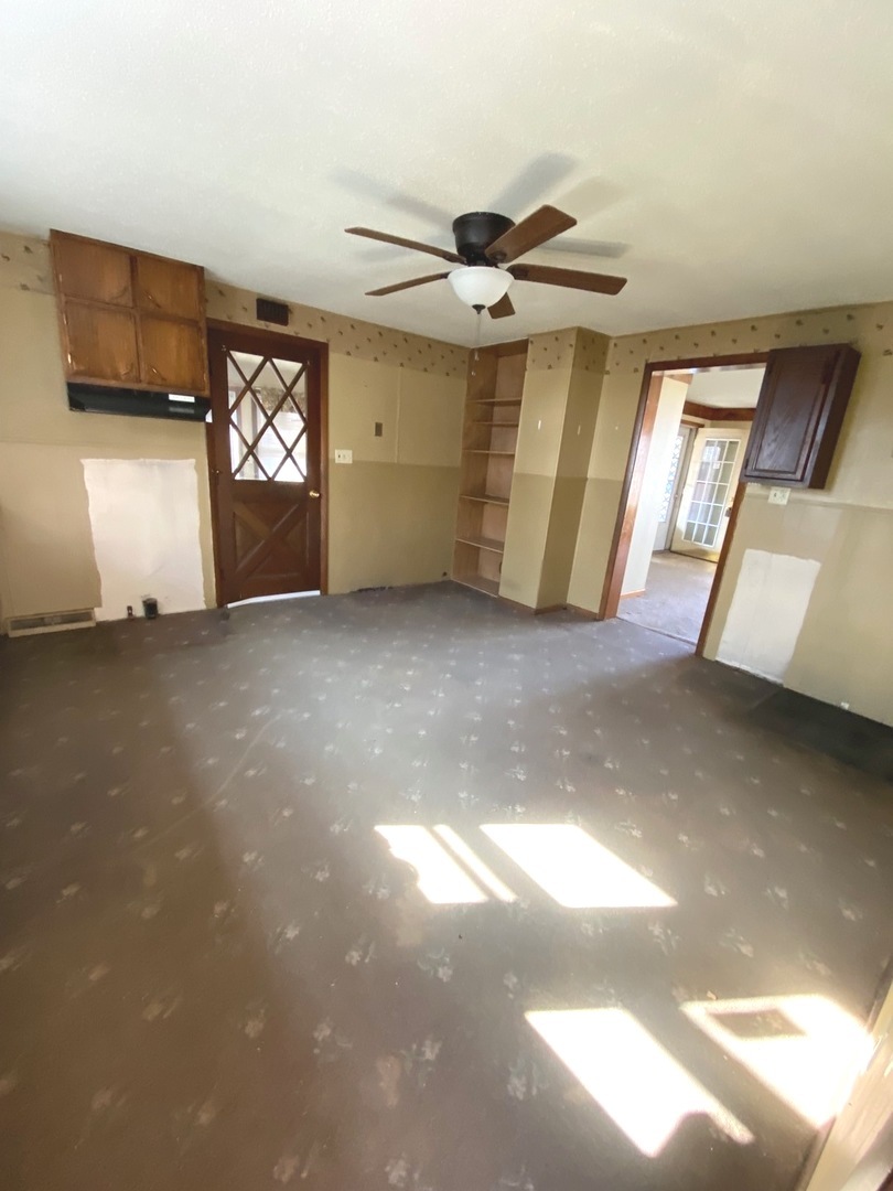 404 North Main Coleta, IL 61081 - Photo 8 of 32 a view of an empty room with a window