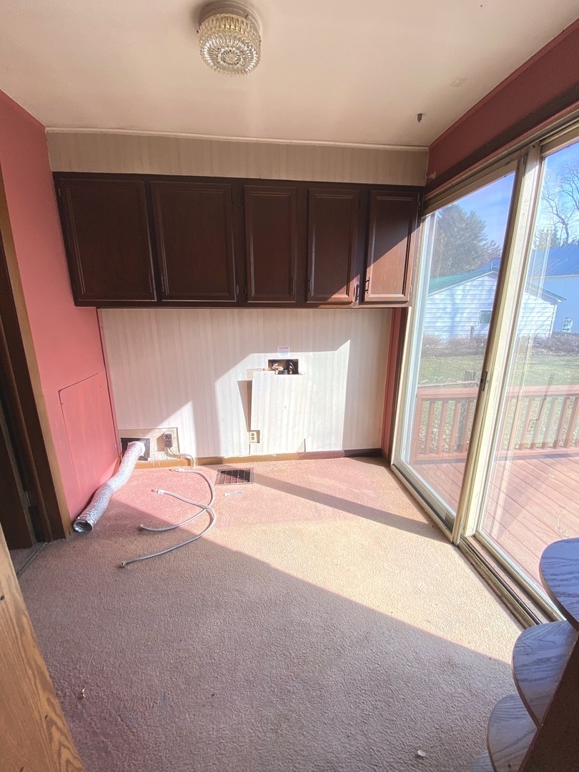 404 North Main Coleta, IL 61081 - Photo 9 of 32 a view of a kitchen with a sink and a window
