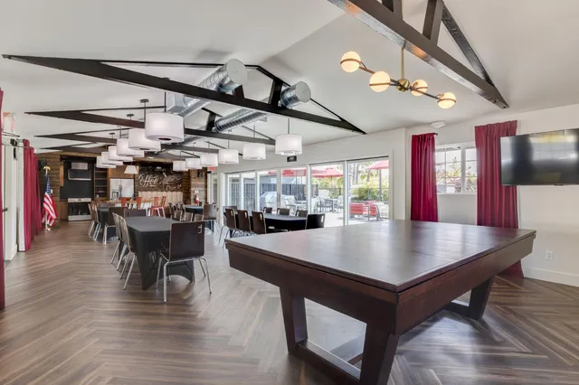 a view of a dining area with furniture and wooden floor