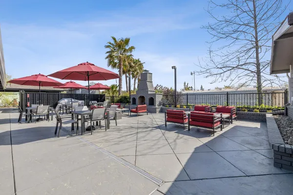 a view of a chairs and tables in the patio