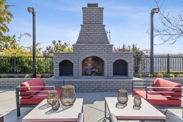 a front view of a house with sitting area