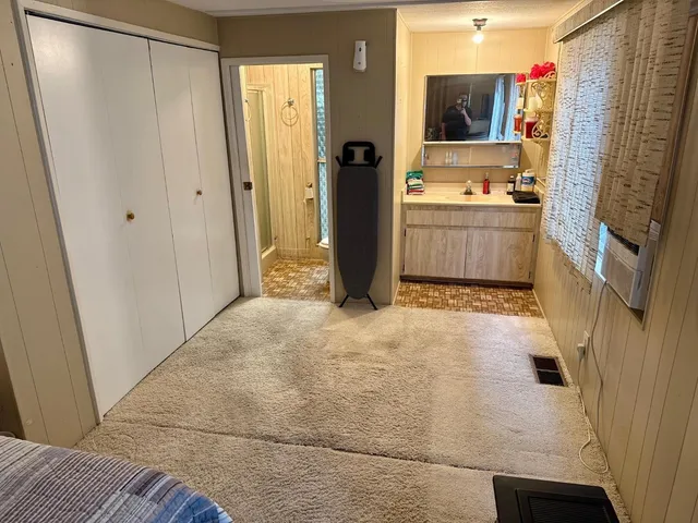 a bathroom with a sink a mirror and a bath tub