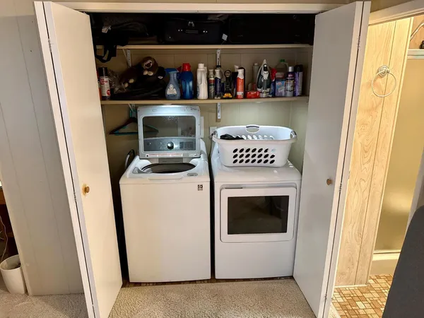 a kitchen with a washer and dryer