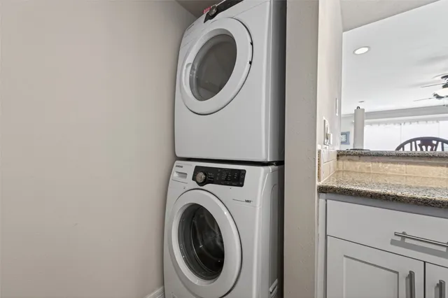 a kitchen with stainless steel appliances granite countertop a sink and cabinets