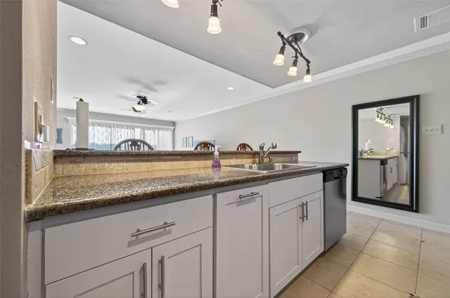 a view of kitchen and dining area with furniture