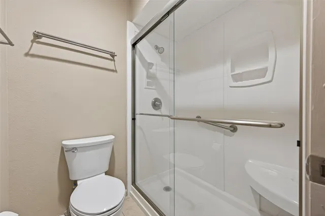 a view of a house with a yard and balcony