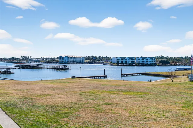 a view of a balcony with wooden floor and city view