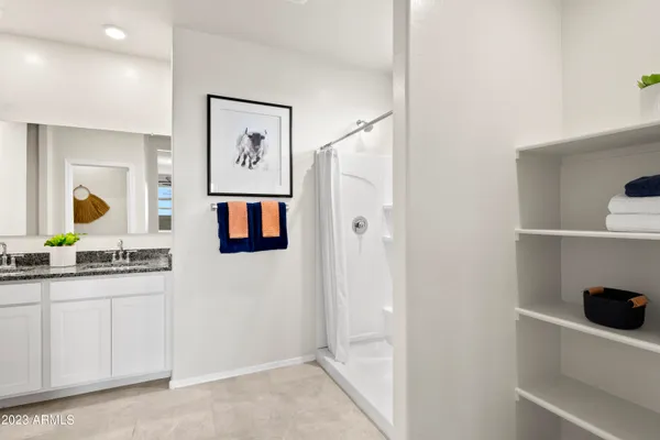 a view of a bathroom with dual sinks