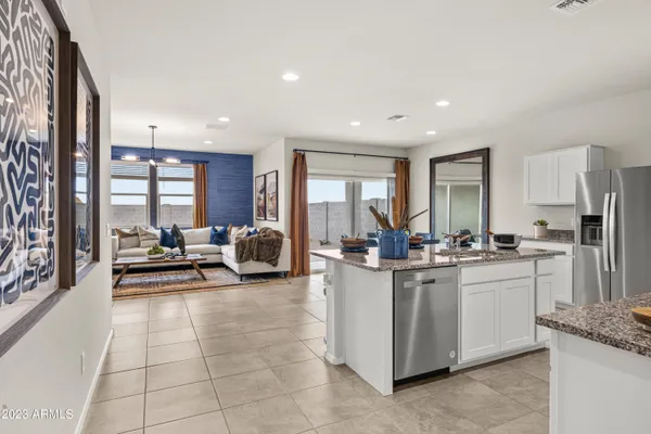 a kitchen with stainless steel appliances granite countertop a sink and cabinets