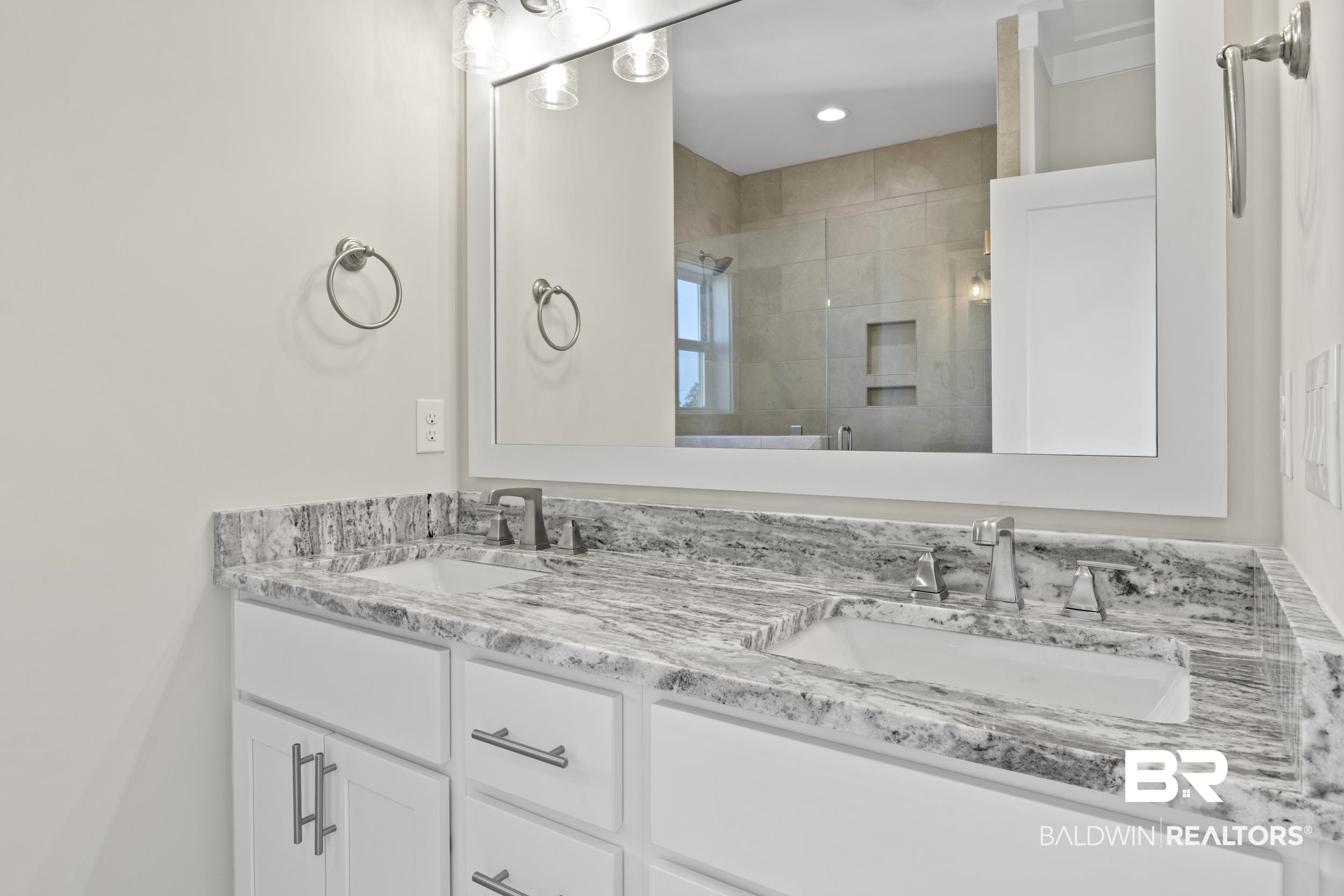 2847 Salt Drive Orange Beach, AL 36561 - Photo 16 of 29 Bathroom featuring vanity and a shower with shower door