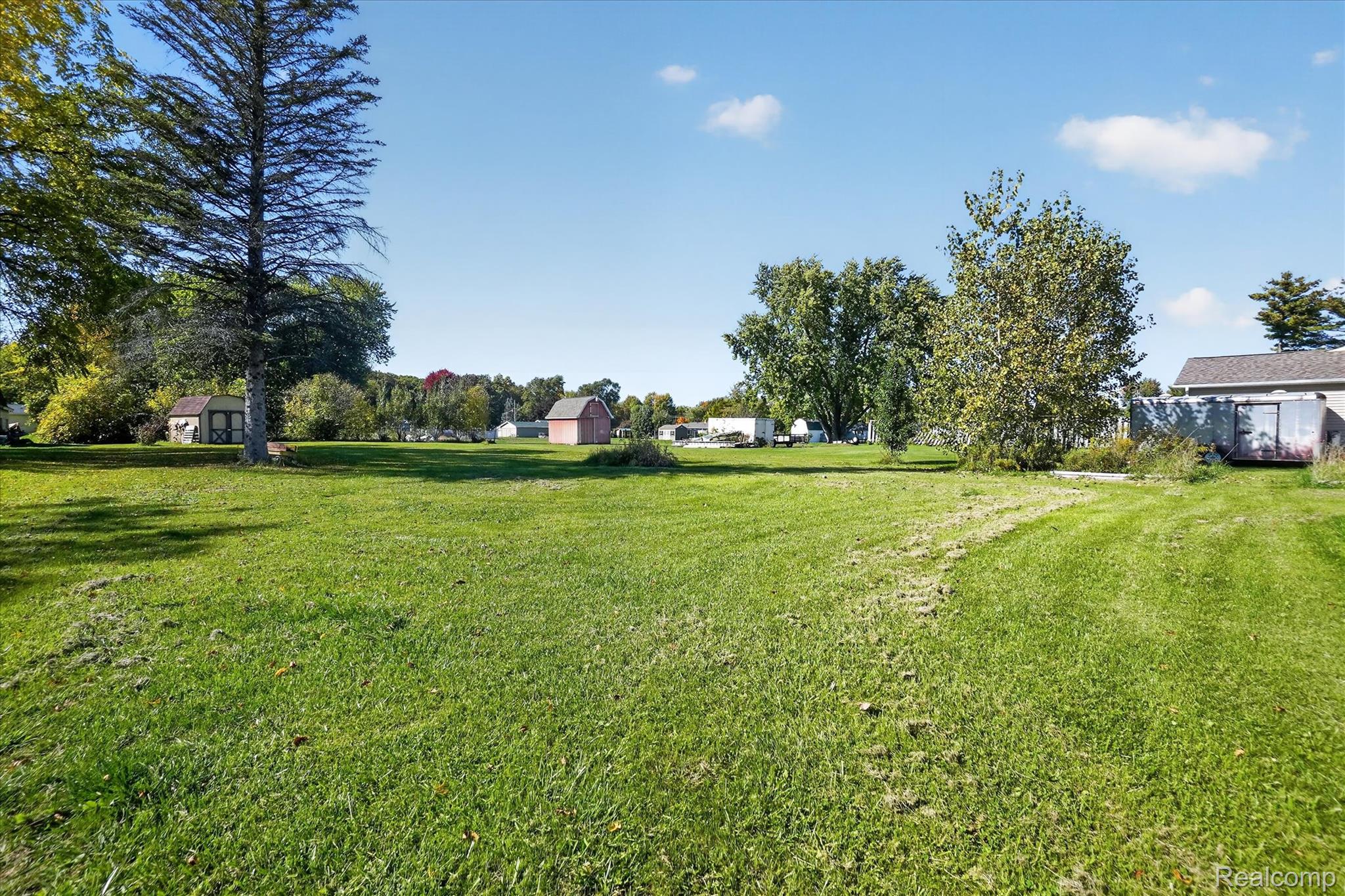 7178 Riegler Street Grand Blanc, MI 48439 - Photo 30 of 31 Expansive green space with mature trees