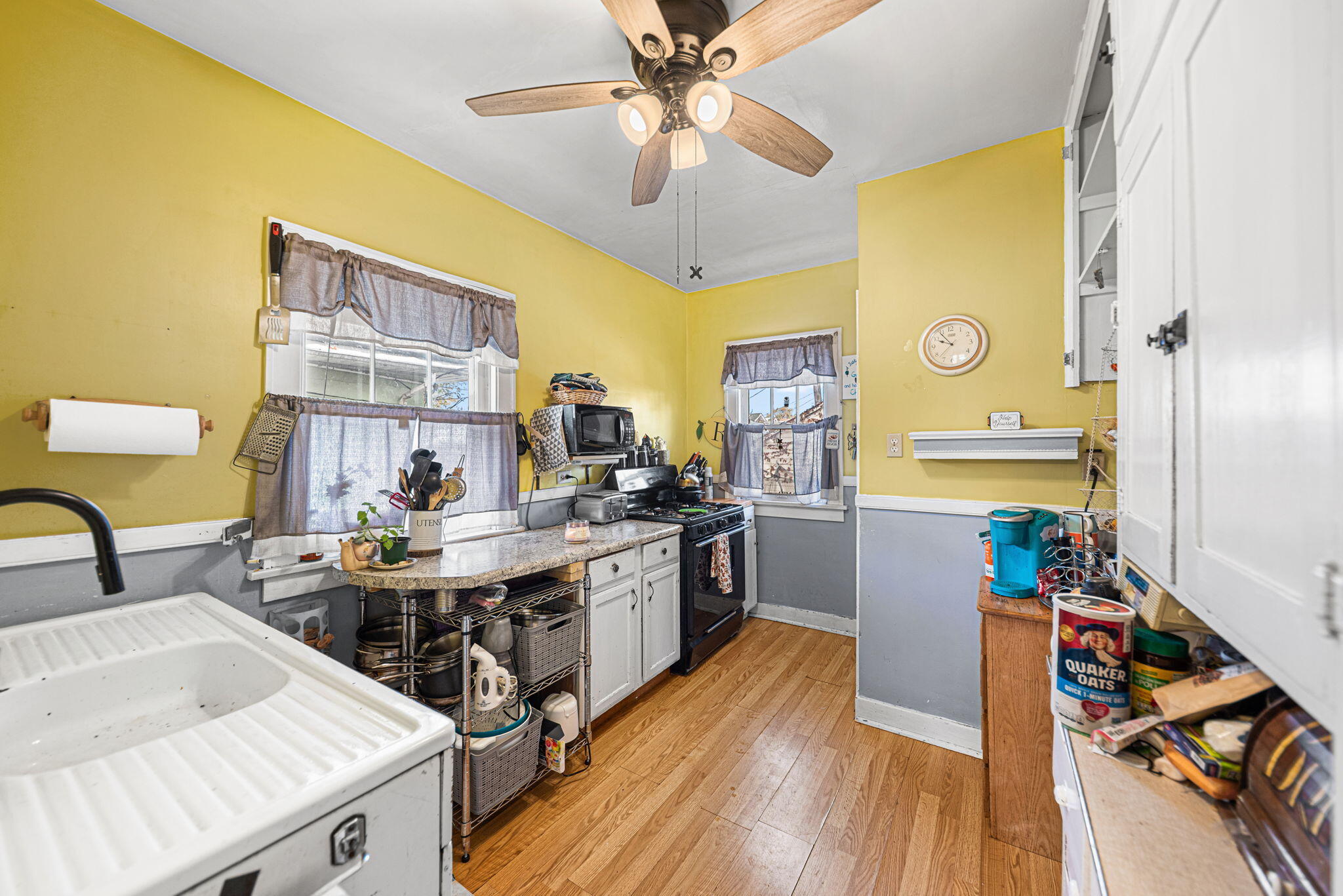 515 165th Street Hammond, IN 46324 - Photo 12 of 19 a kitchen that has a lot of cabinets stainless steel appliances and a dining table