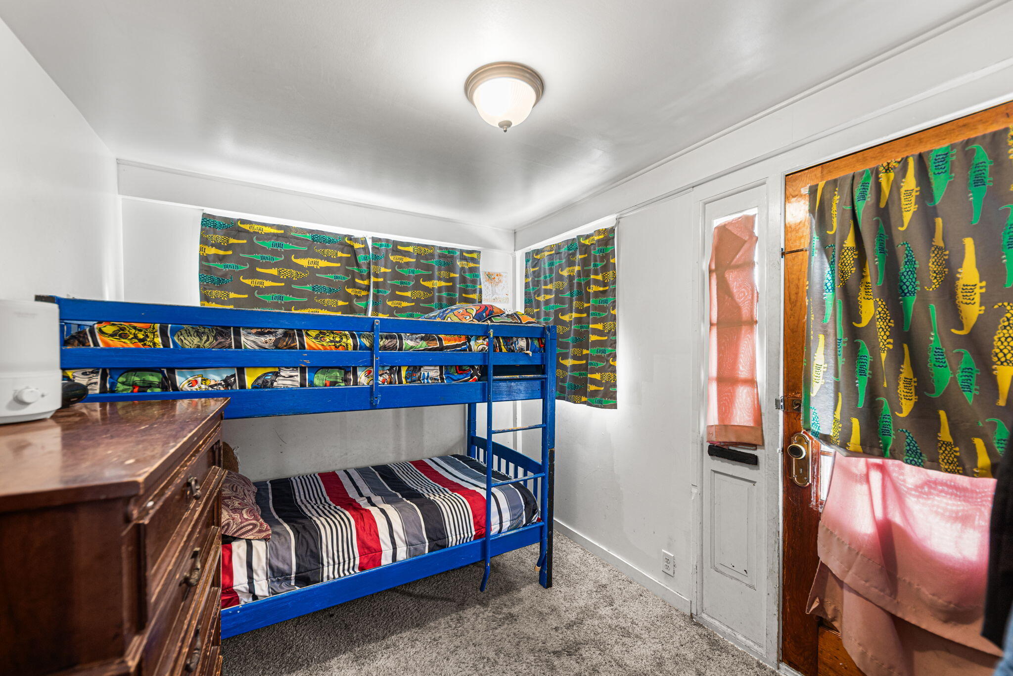 515 165th Street Hammond, IN 46324 - Photo 16 of 19 a bedroom with furniture and a book shelf
