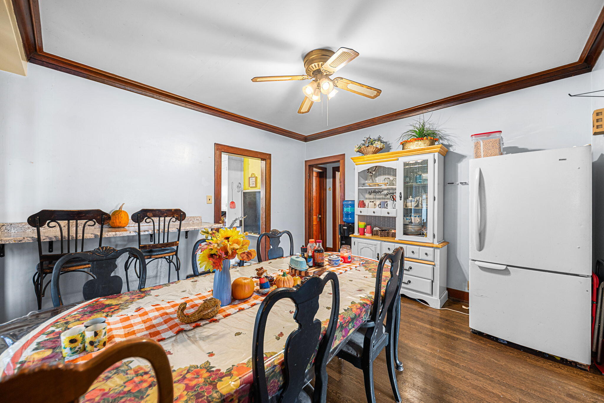 515 165th Street Hammond, IN 46324 - Photo 9 of 19 a dining room with furniture a chandelier and wooden floor