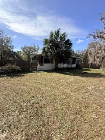 a view of a patio with a yard