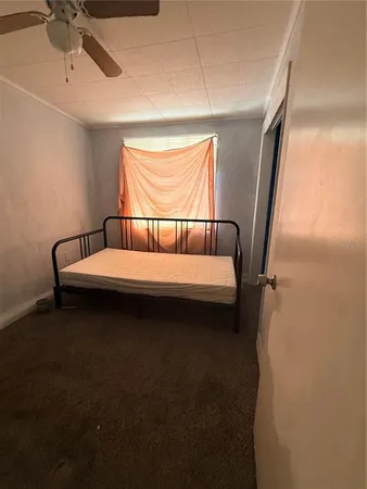 a view of room with furniture and a window