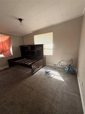 a view of a livingroom with a ceiling fan and window