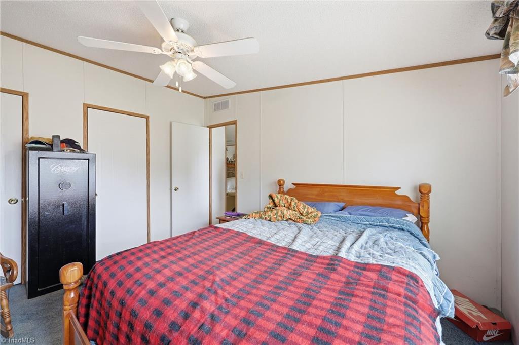 4790 Waynick Meadow Road Asheboro, NC 27205 - Photo 16 of 33 Primary bedroom with direct access to the living area.