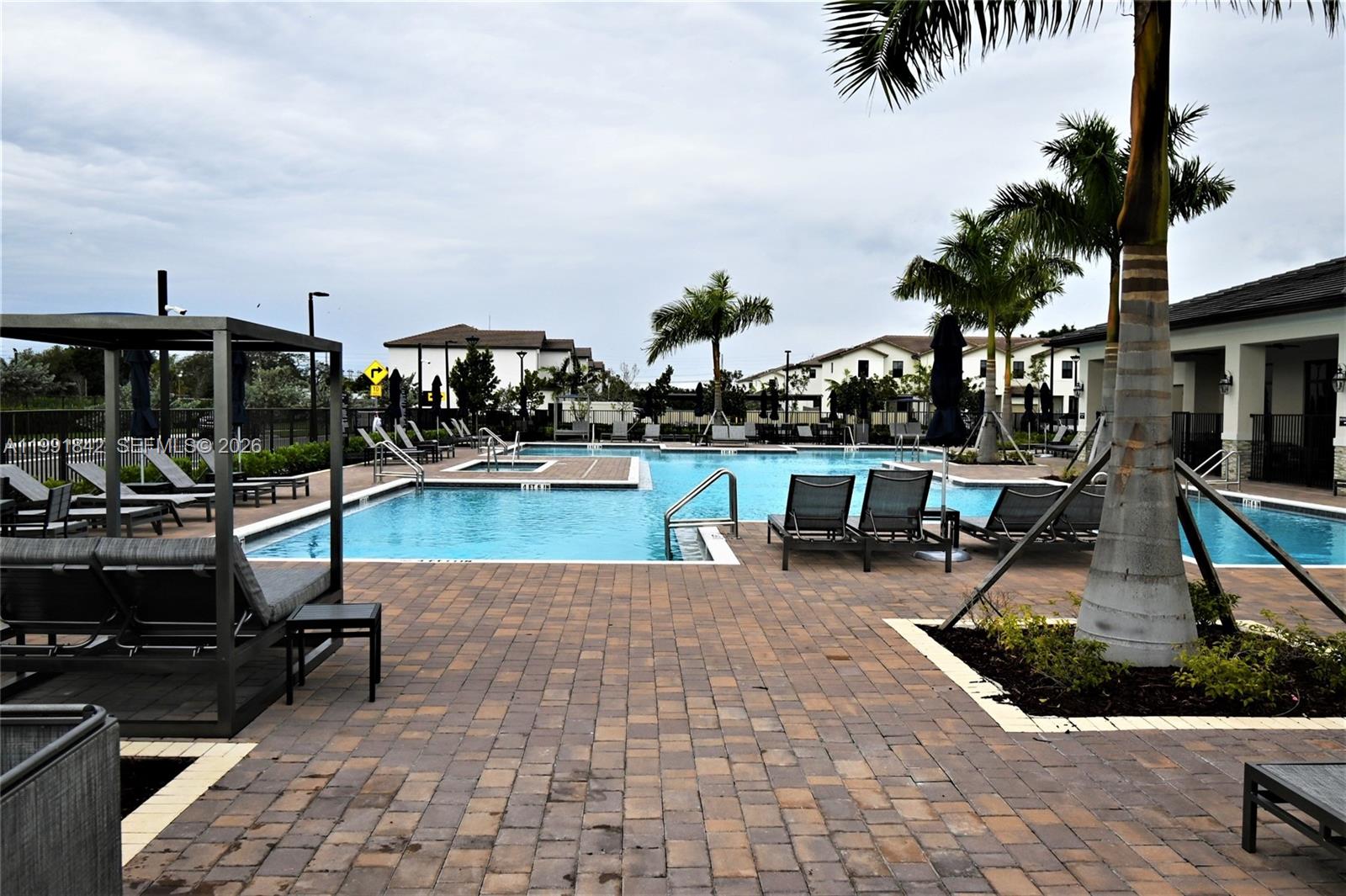 12986 Southwest 232nd Terrace, Unit 12986 Homestead, FL 33032 - Photo 11 of 11 a view of a swimming pool with chairs