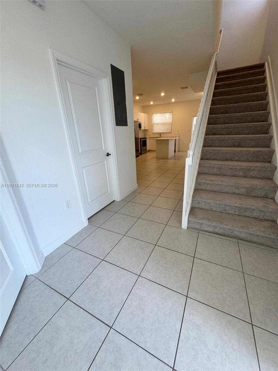 12986 Southwest 232nd Terrace, Unit 12986 Homestead, FL 33032 - Photo 4 of 11 a view of entryway and hall