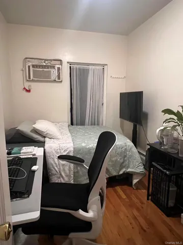 a bedroom with a bed and a chair