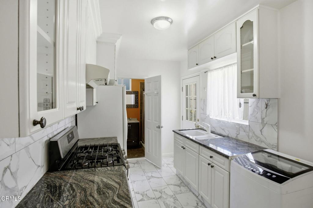 1606 Glenwood Road, Unit A Glendale, CA 91201 - Photo 11 of 28 a kitchen with a sink stove and refrigerator