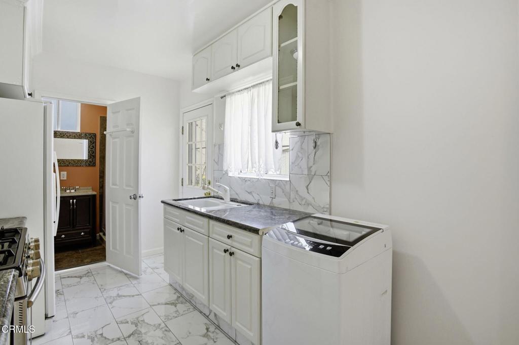1606 Glenwood Road, Unit A Glendale, CA 91201 - Photo 12 of 28 a kitchen that has a sink and a stove