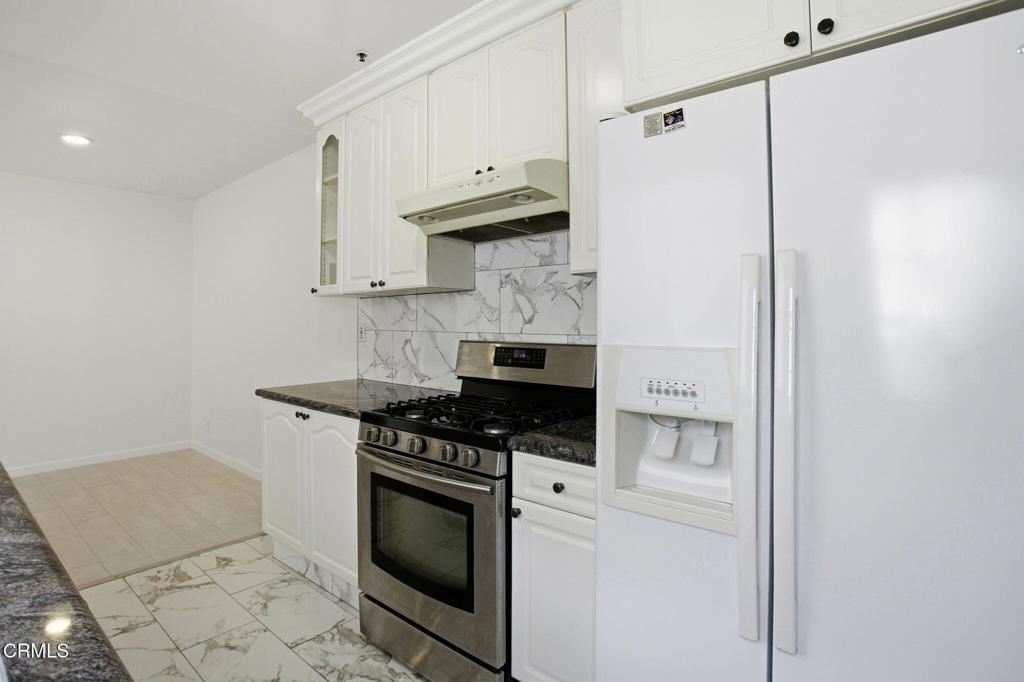 1606 Glenwood Road, Unit A Glendale, CA 91201 - Photo 13 of 28 a kitchen with stainless steel appliances a stove and a refrigerator