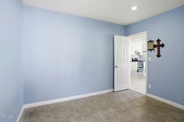 hallway with wooden floor and front door