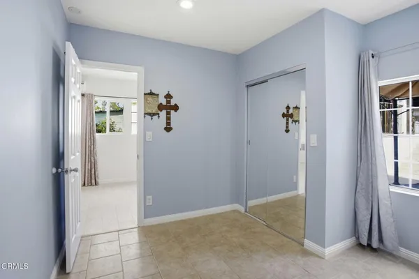 a view of an empty room with windows