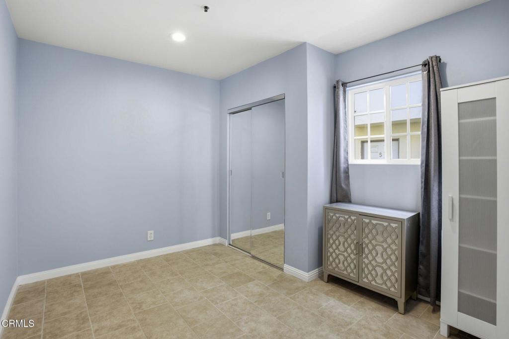 1606 Glenwood Road, Unit A Glendale, CA 91201 - Photo 18 of 28 a view of an empty room with windows