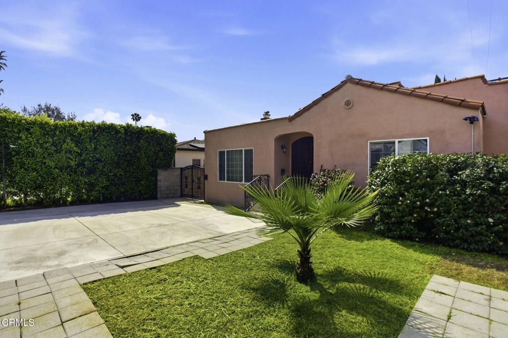1606 Glenwood Road, Unit A Glendale, CA 91201 - Photo 2 of 28 a view of a small garden in front of a house