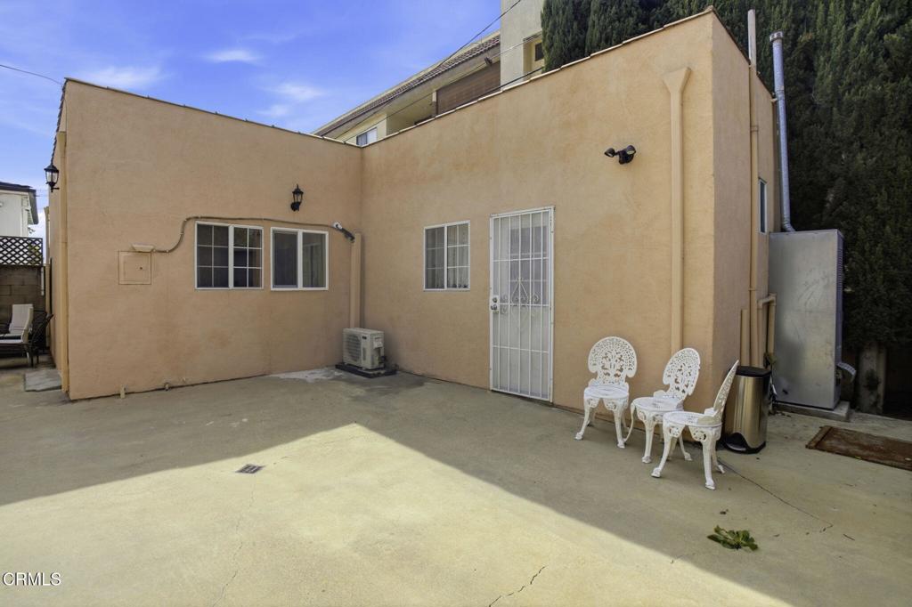 1606 Glenwood Road, Unit A Glendale, CA 91201 - Photo 26 of 28 a view of a patio with a table and chairs and ice snow