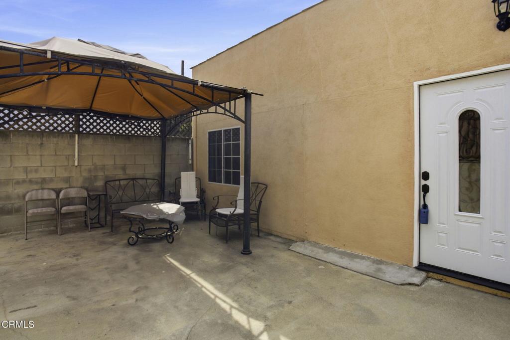 1606 Glenwood Road, Unit A Glendale, CA 91201 - Photo 27 of 28 an outdoor space with furniture and umbrella