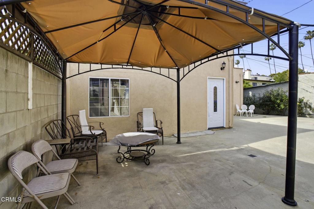 1606 Glenwood Road, Unit A Glendale, CA 91201 - Photo 28 of 28 a backyard of a house with table and chairs