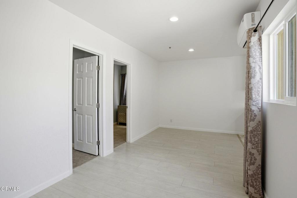 1606 Glenwood Road, Unit A Glendale, CA 91201 - Photo 6 of 28 an empty room with windows and closet