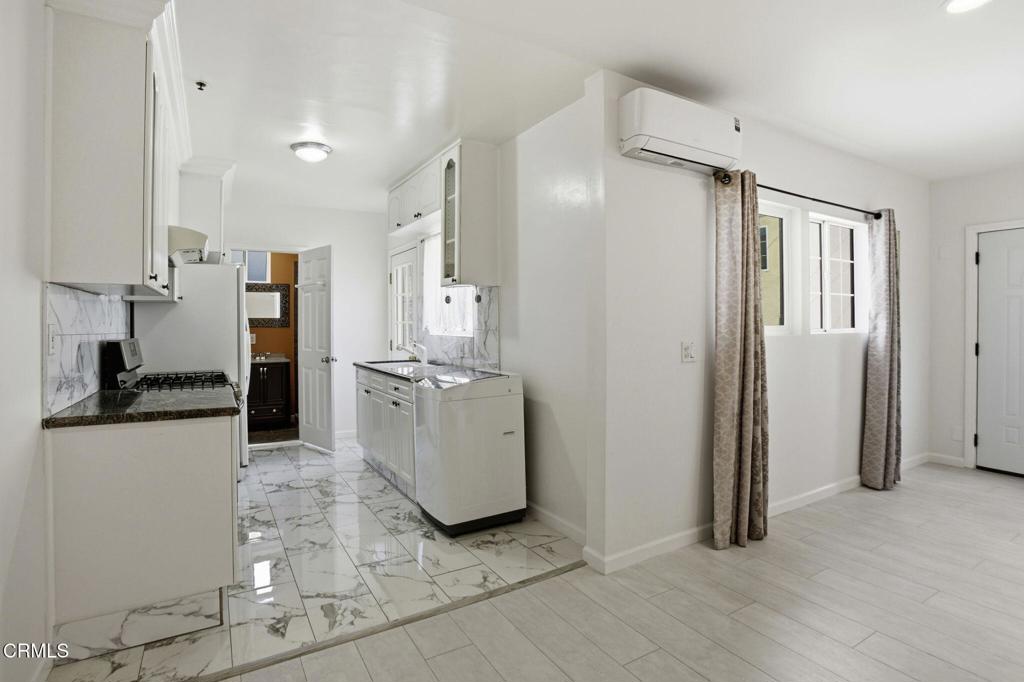 1606 Glenwood Road, Unit A Glendale, CA 91201 - Photo 9 of 28 a view of a kitchen with refrigerator and wooden floor