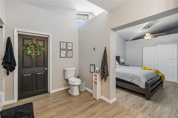 a bedroom with two beds and a window