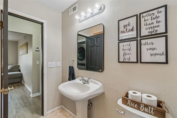 a view of a hallway with washer and dryer