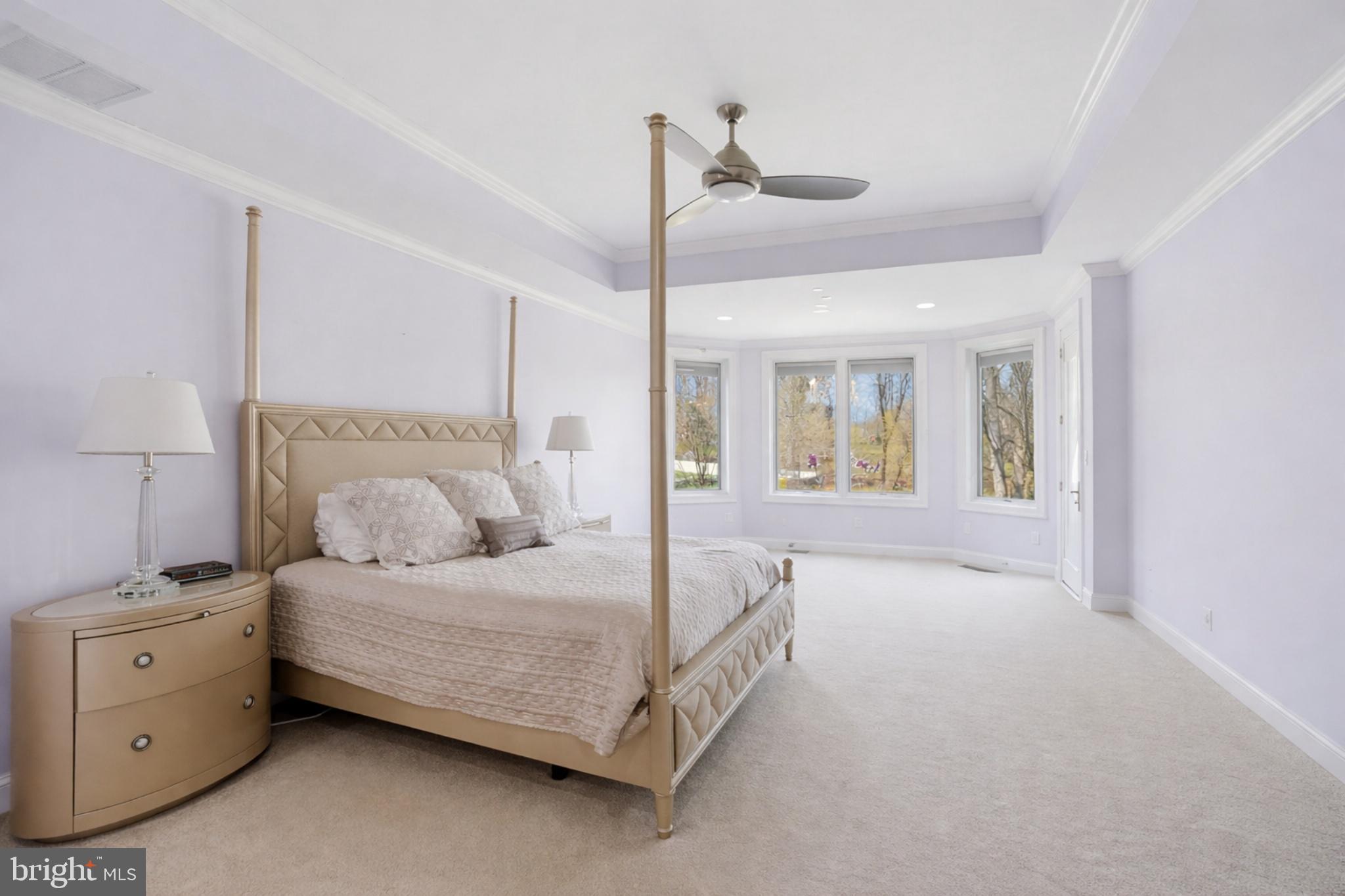 10708 Lockland Road Potomac, MD 20854 - Photo 28 of 69 a bedroom with a bed and a chandelier