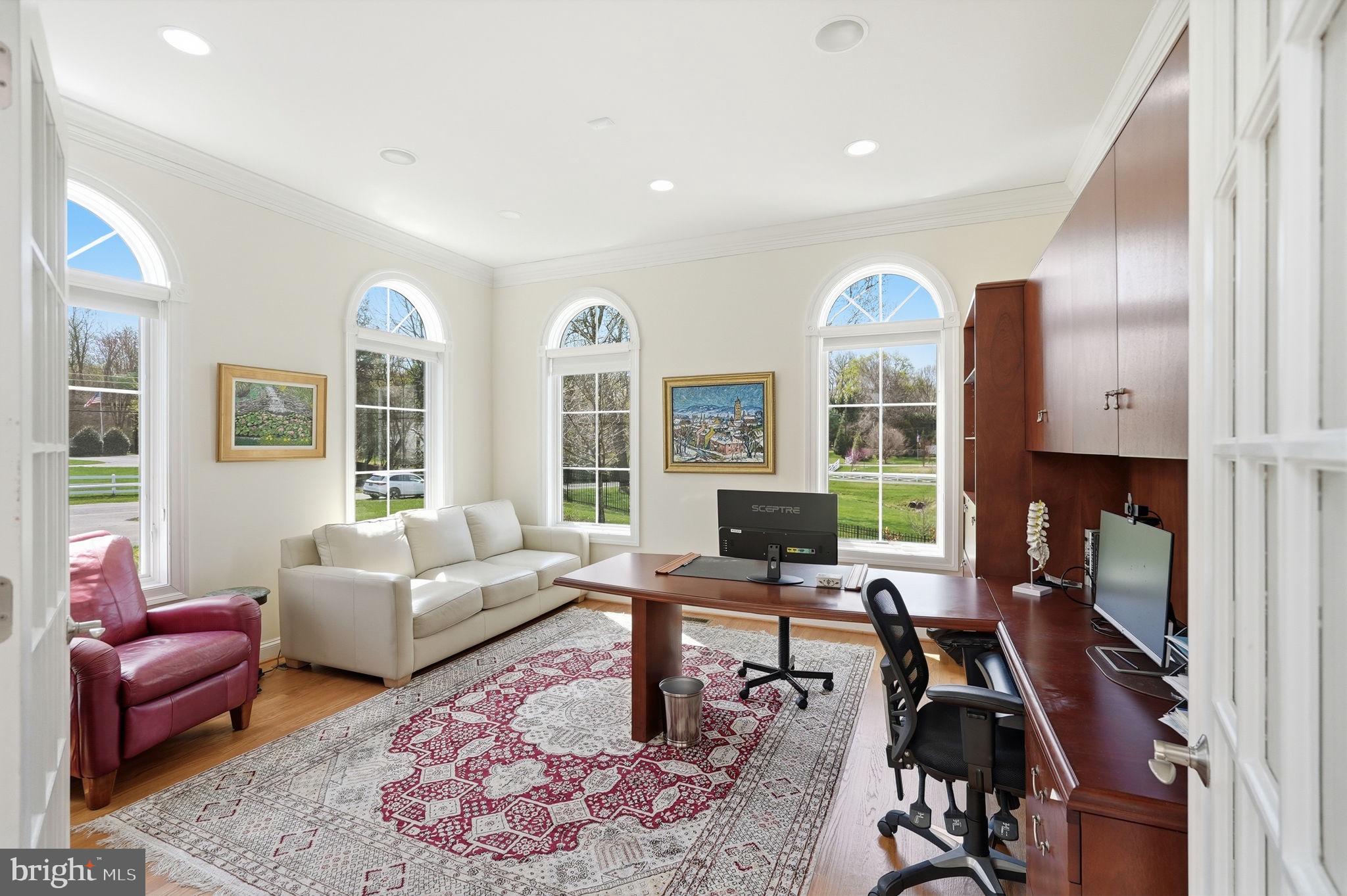 10708 Lockland Road Potomac, MD 20854 - Photo 37 of 69 a living room with furniture rug and a large window